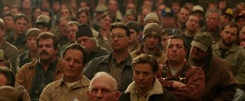 Movie still from “North Country” (2005), directed by Niki Caro – A group of people sitting in front of each other; Medium shot, High angle