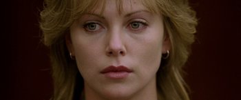 Movie still from “North Country” (2005), directed by Niki Caro – A woman's face with green eyes; Close Up shot, Overhead angle