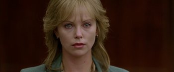 Movie still from “North Country” (2005), directed by Niki Caro – A person wearing a green shirt; Close Up shot, Over the shoulder angle