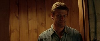 Movie still from “North Country” (2005), directed by Niki Caro – A person wearing a shirt; Close Up shot, Over the shoulder angle