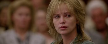 Movie still from “North Country” (2005), directed by Niki Caro – A person wearing a green shirt; Close Up shot, Over the shoulder angle