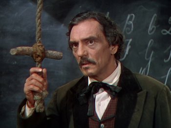 Movie still from “North West Mounted Police” (1940), directed by Cecil B. DeMille – A person holding a rope; Close Up shot, High angle