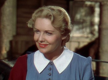 Movie still from “North West Mounted Police” (1940), directed by Cecil B. DeMille – A person wearing a dress; Close Up shot, Over the shoulder angle