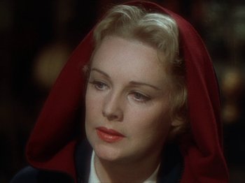 Movie still from “North West Mounted Police” (1940), directed by Cecil B. DeMille – A person wearing a hood; Close Up shot, Over the shoulder angle