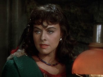 Movie still from “North West Mounted Police” (1940), directed by Cecil B. DeMille – A person wearing a necklace; Close Up shot, Over the shoulder angle