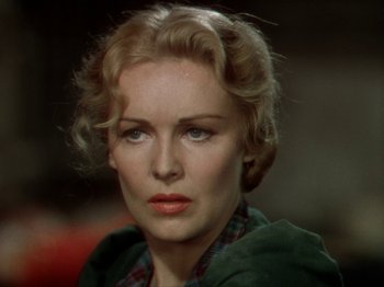 Movie still from “North West Mounted Police” (1940), directed by Cecil B. DeMille – A person wearing a green jacket; Close Up shot, Over the shoulder angle