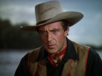 Movie still from “North West Mounted Police” (1940), directed by Cecil B. DeMille – A person wearing a cowboy hat; Close Up shot, Over the shoulder angle