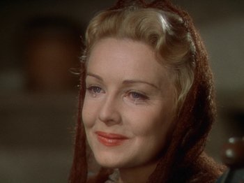 Movie still from “North West Mounted Police” (1940), directed by Cecil B. DeMille – A person wearing a hood; Close Up shot, Over the shoulder angle