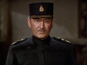 Movie still from “North West Mounted Police” (1940), directed by Cecil B. DeMille – A person wearing a uniform; Close Up shot, Low angle