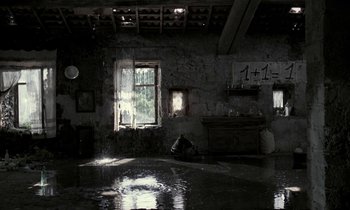 Movie still from “Nostalghia” (1983), directed by Andrei Tarkovsky – A room that has water in the floor; Extreme Wide shot, High angle
