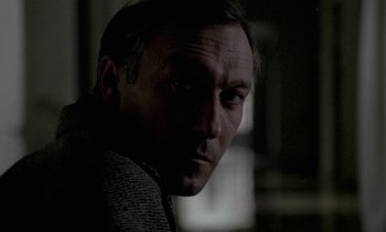 Movie still from “Nostalghia” (1983), directed by Andrei Tarkovsky – A person wearing a jacket; Close Up shot, Over the shoulder angle