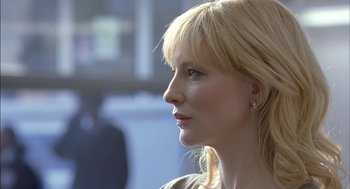 Movie still from “Notes on a Scandal” (2006), directed by Richard Eyre – A woman with blonde hair looking to her left; Close Up shot, Over the shoulder angle