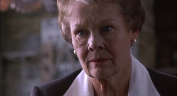 Movie still from “Notes on a Scandal” (2006), directed by Richard Eyre – An older woman with a serious look on her face; Close Up shot, Low angle