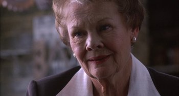 Movie still from “Notes on a Scandal” (2006), directed by Richard Eyre – An older woman is looking at the camera; Close Up shot, Low angle