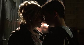 Movie still from “Notes on a Scandal” (2006), directed by Richard Eyre – A man and a woman kissing in the dark; Close Up shot, Low angle