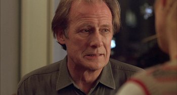 Movie still from “Notes on a Scandal” (2006), directed by Richard Eyre – An older man is looking into the camera; Close Up shot, Over the shoulder angle