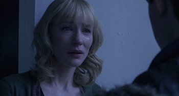 Movie still from “Notes on a Scandal” (2006), directed by Richard Eyre – A person looking at a camera; Close Up shot, Over the shoulder angle