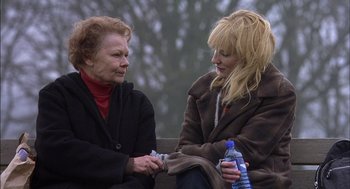 Movie still from “Notes on a Scandal” (2006), directed by Richard Eyre – Two women sitting next to each other on a park bench; Close Up shot, Over the shoulder angle