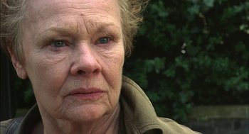 Movie still from “Notes on a Scandal” (2006), directed by Richard Eyre – An older woman with a concerned look on her face; Close Up shot, Low angle