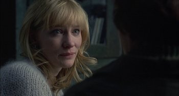 Movie still from “Notes on a Scandal” (2006), directed by Richard Eyre – A person sitting in front of another person; Close Up shot, Over the shoulder angle