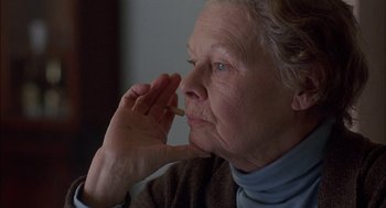 Movie still from “Notes on a Scandal” (2006), directed by Richard Eyre – An older woman holding a stick in her hand; Close Up shot, Over the shoulder angle