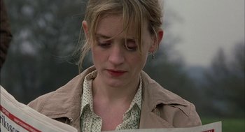 Movie still from “Notes on a Scandal” (2006), directed by Richard Eyre – A person reading a book; Close Up shot, Low angle
