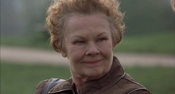 Movie still from “Notes on a Scandal” (2006), directed by Richard Eyre – An older woman with a brown jacket on; Close Up shot, Low angle