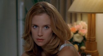 Movie still from “Nothing to Lose” (1997), directed by Steve Oedekerk – A person with long brown hair; Close Up shot, Over the shoulder angle