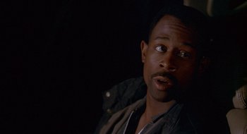 Movie still from “Nothing to Lose” (1997), directed by Steve Oedekerk – A person with a jacket on; Close Up shot, Over the shoulder angle