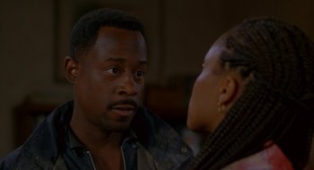 Movie still from “Nothing to Lose” (1997), directed by Steve Oedekerk – A man and a woman talking to each other; Close Up shot, Over the shoulder angle