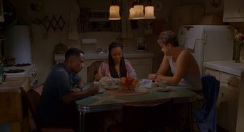 Movie still from “Nothing to Lose” (1997), directed by Steve Oedekerk – A group of people sitting around a table; Wide shot, High angle