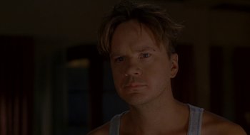 Movie still from “Nothing to Lose” (1997), directed by Steve Oedekerk – A person wearing a tank top; Close Up shot, Low angle