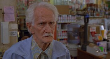 Movie still from “Nothing to Lose” (1997), directed by Steve Oedekerk – An old man with white hair wearing a tie; Close Up shot, Low angle