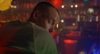 Movie still from “Nothing to Lose” (1997), directed by Steve Oedekerk – A person with his head on his shoulder; Close Up shot, Over the shoulder angle