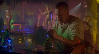 Movie still from “Nothing to Lose” (1997), directed by Steve Oedekerk – A man sitting at a table in front of a woman; Medium shot, Low angle