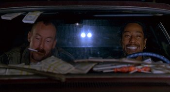 Movie still from “Nothing to Lose” (1997), directed by Steve Oedekerk – Two men in the back seat of a car; Close Up shot, Low angle