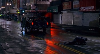Movie still from “Nothing to Lose” (1997), directed by Steve Oedekerk – A car that is parked on the side of the street; Wide shot, High angle