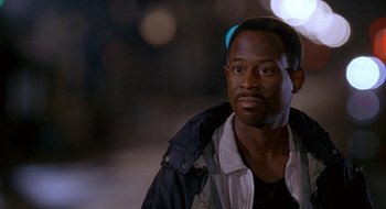 Movie still from “Nothing to Lose” (1997), directed by Steve Oedekerk – A person wearing a jacket; Close Up shot, High angle