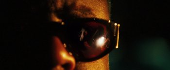 Movie still from “Notorious” (2009), directed by George Tillman Jr. – A person wearing a pair of sunglasses; Extreme Close Up shot, Low angle