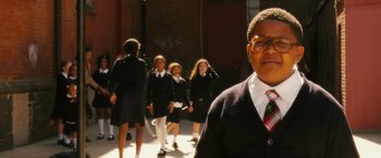 Movie still from “Notorious” (2009), directed by George Tillman Jr. – A group of school children walking down a sidewalk; Close Up shot, Low angle