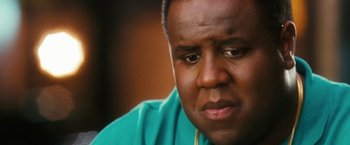 Movie still from “Notorious” (2009), directed by George Tillman Jr. – A person with a green shirt; Close Up shot, Low angle