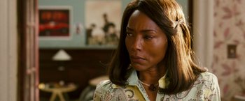 Movie still from “Notorious” (2009), directed by George Tillman Jr. – A person with long hair; Close Up shot, Over the shoulder angle