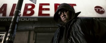 Movie still from “Notorious” (2009), directed by George Tillman Jr. – A man wearing a black jacket and a black hood; Close Up shot, Low angle