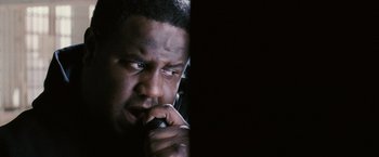 Movie still from “Notorious” (2009), directed by George Tillman Jr. – A person talking on a cell phone; Close Up shot, Low angle