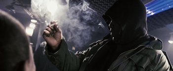 Movie still from “Notorious” (2009), directed by George Tillman Jr. – A man smoking a cigarette in the dark; Close Up shot, Low angle