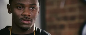 Movie still from “Notorious” (2009), directed by George Tillman Jr. – A person wearing a black shirt; Close Up shot, High angle