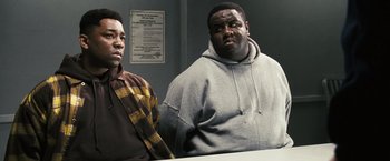 Movie still from “Notorious” (2009), directed by George Tillman Jr. – Two men standing next to each other in front of a mirror; Medium shot, Low angle