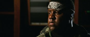 Movie still from “Notorious” (2009), directed by George Tillman Jr. – A person wearing a headscarf; Close Up shot, Low angle