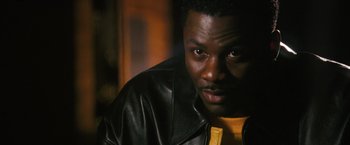 Movie still from “Notorious” (2009), directed by George Tillman Jr. – A person wearing a leather jacket; Close Up shot, High angle