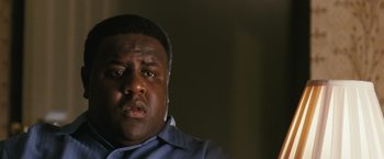 Movie still from “Notorious” (2009), directed by George Tillman Jr. – A person wearing a blue shirt; Close Up shot, Low angle